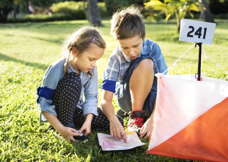 Kids finding direction on a map