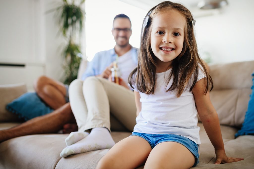 Young little girl enjoying time with her parents